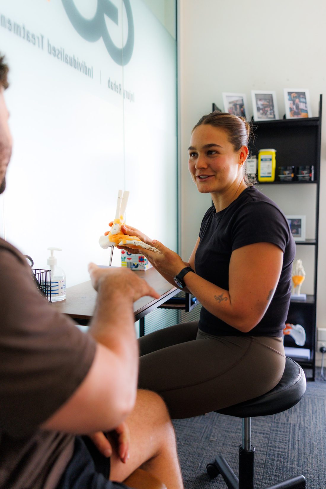 Physiotherapist consulting with a client at Game Changer Physiotherapy, Osborne Park